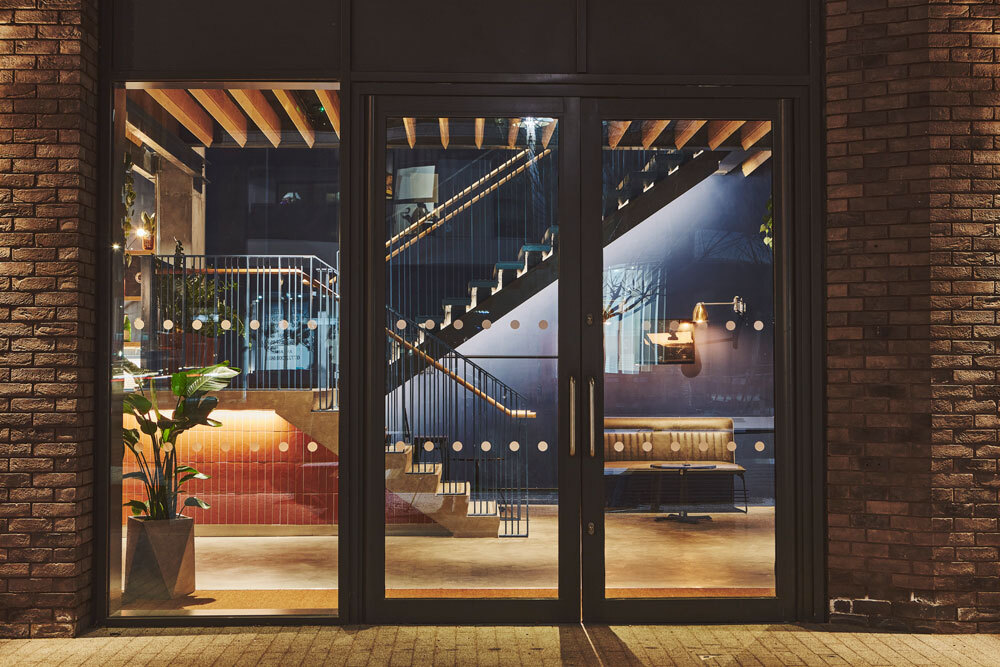 Glass exterior doors showing inside building 