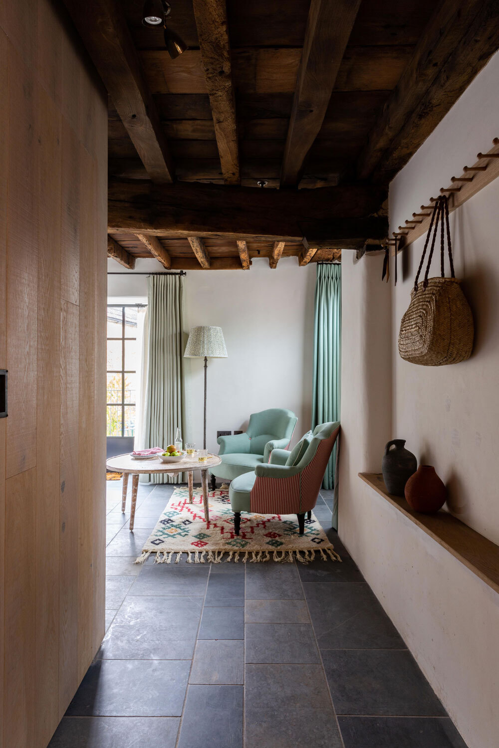 Hallway leading to seating area in bedroom