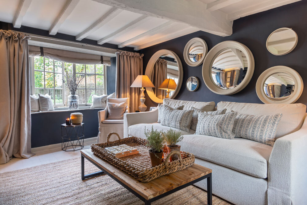 Snug with sofa and circle mirrors