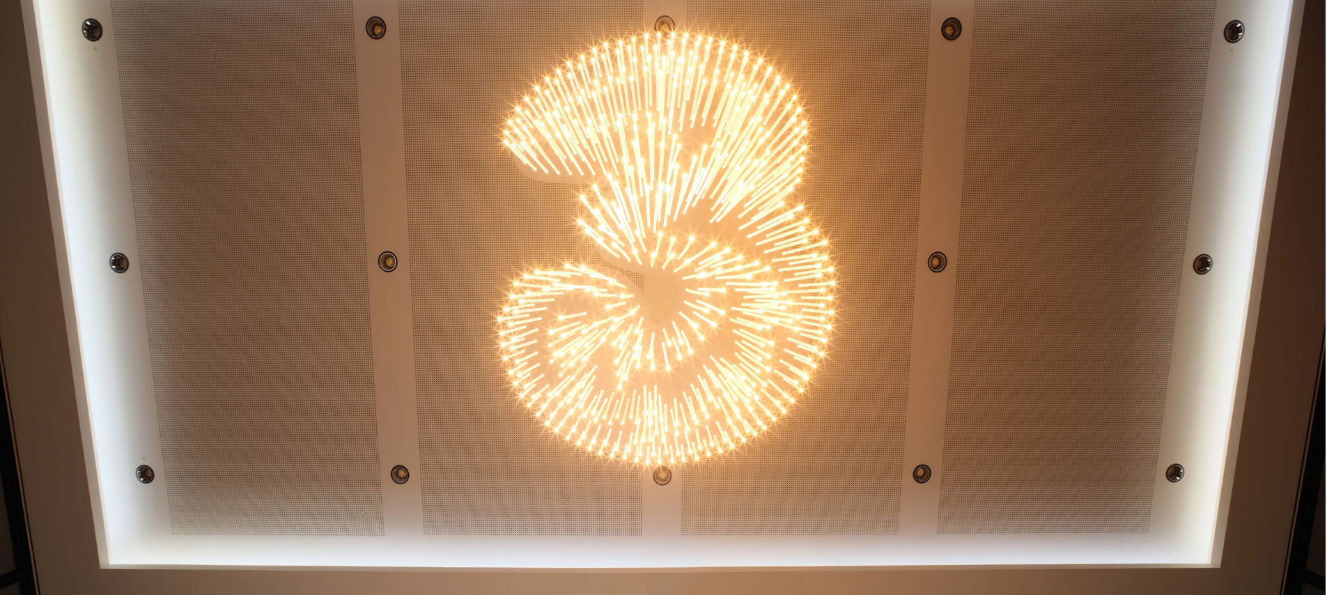 Light in the shape of a 3 on ceiling