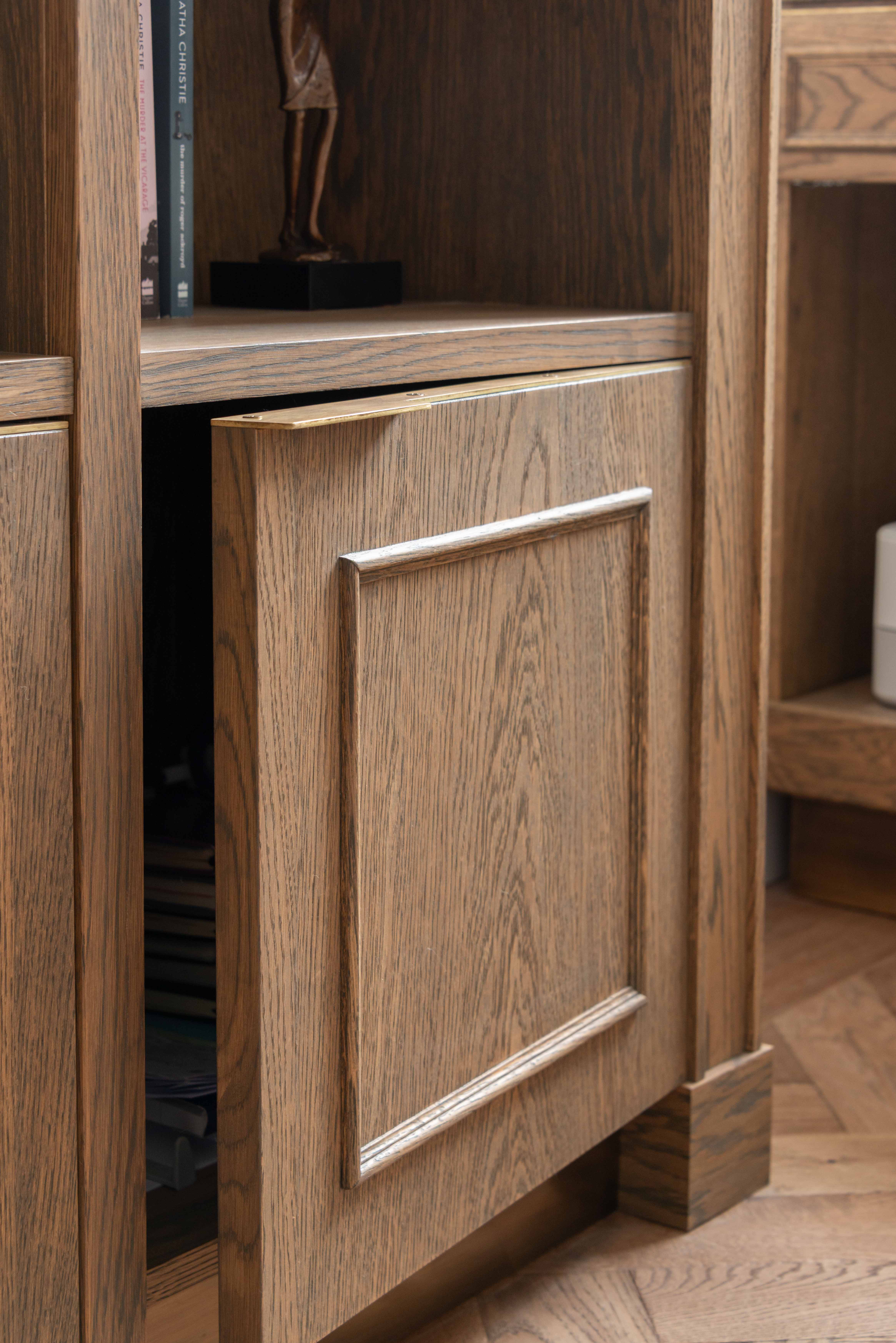 Cupboard detail showing beading detail and bespoke edge pull handle