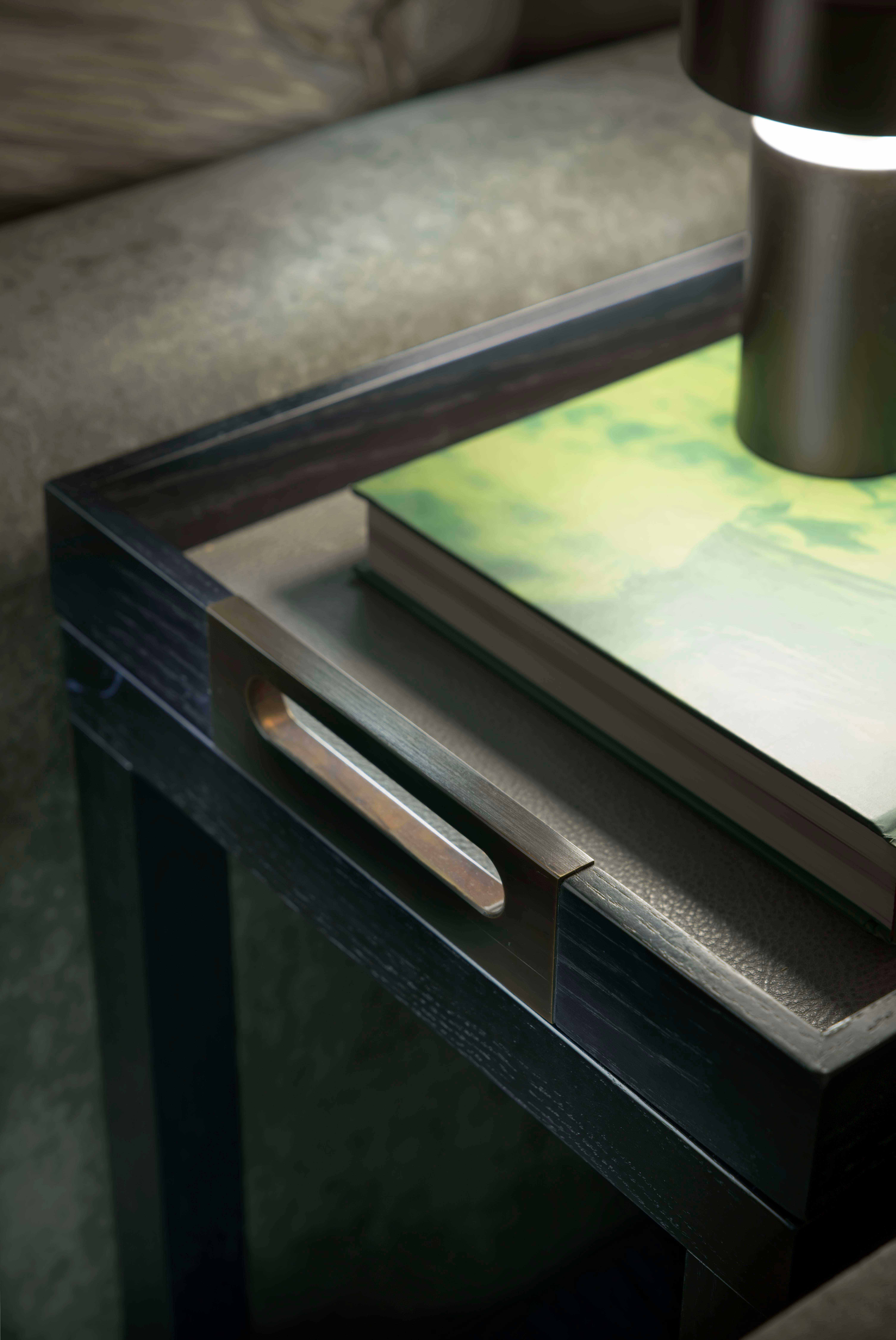 Brushed bronze handles and soft-leather lining added a luxurious touch to the removable trays by Origins Design