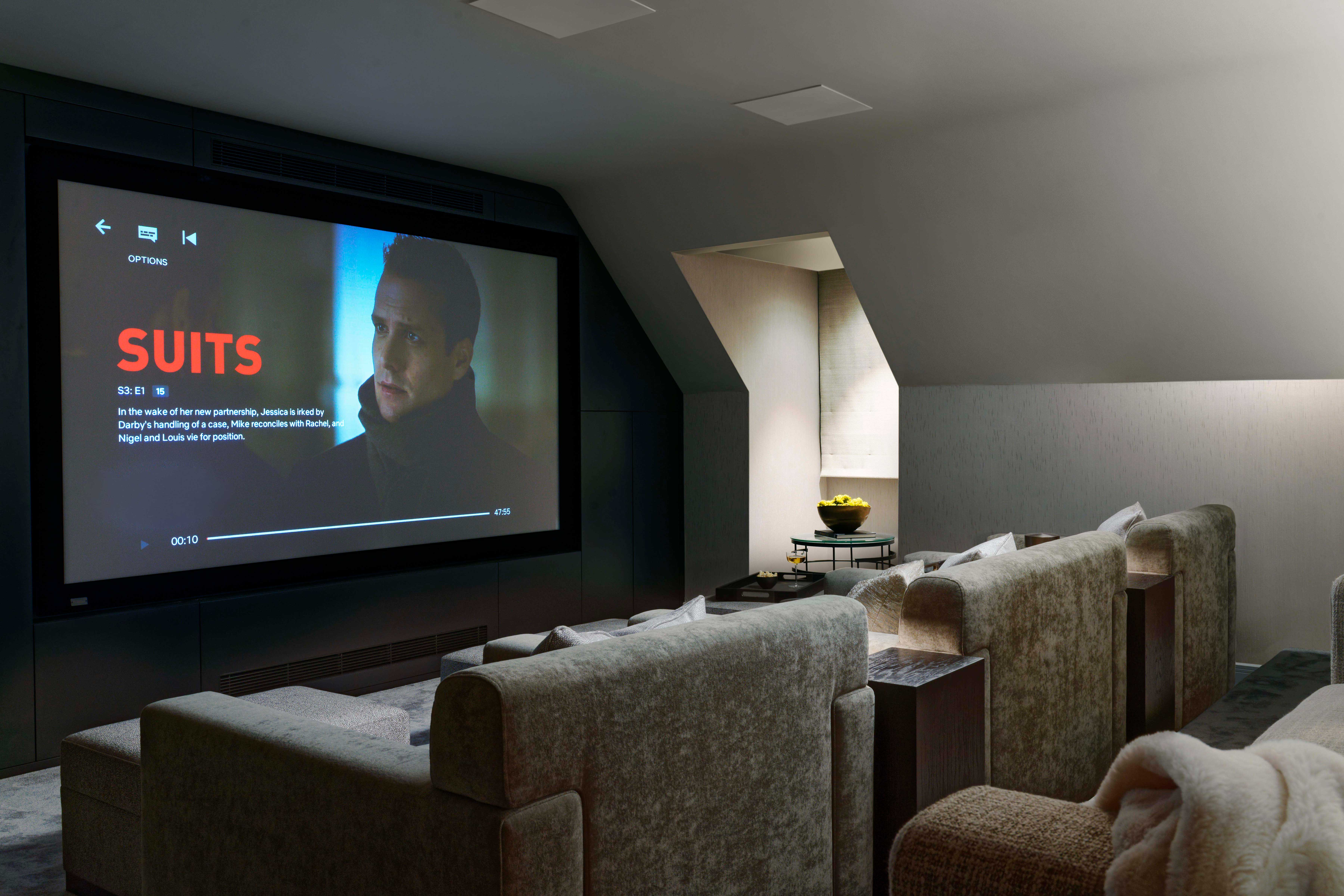 Origins Design crafted an 8m long piece of fitted joinery to house the cinema screen and media equipment