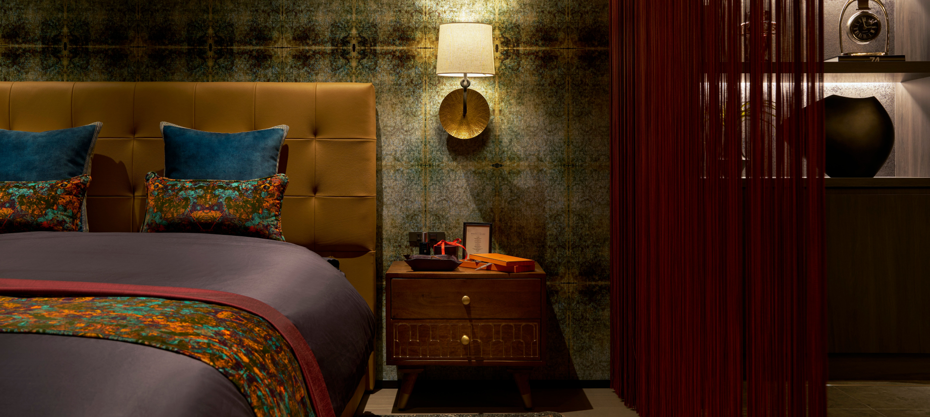 Bedroom with dark walls and furnishings