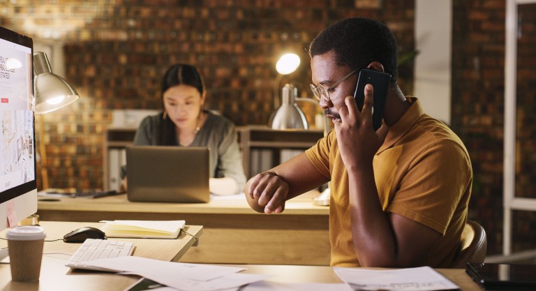 Man working checking phone