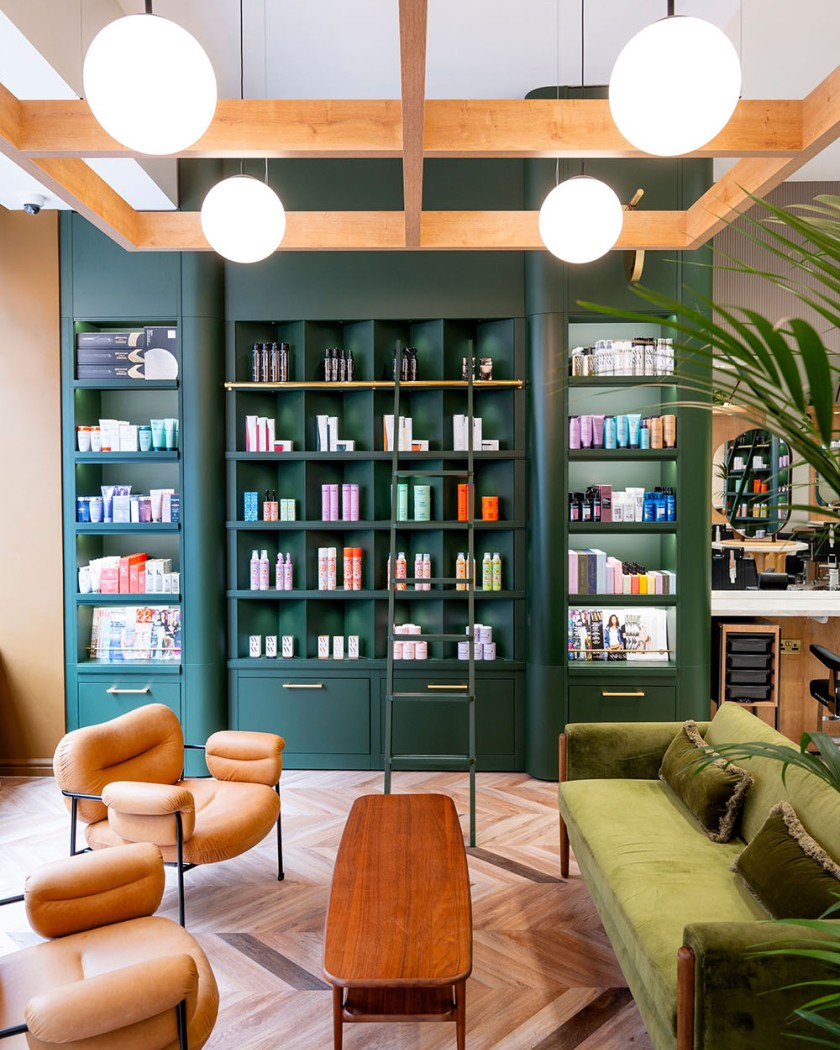 Green bookcase and sofa