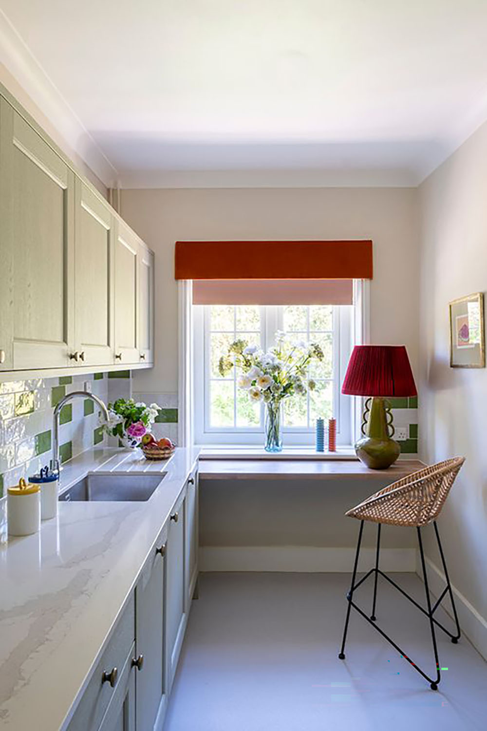 Kitchen with red blinds