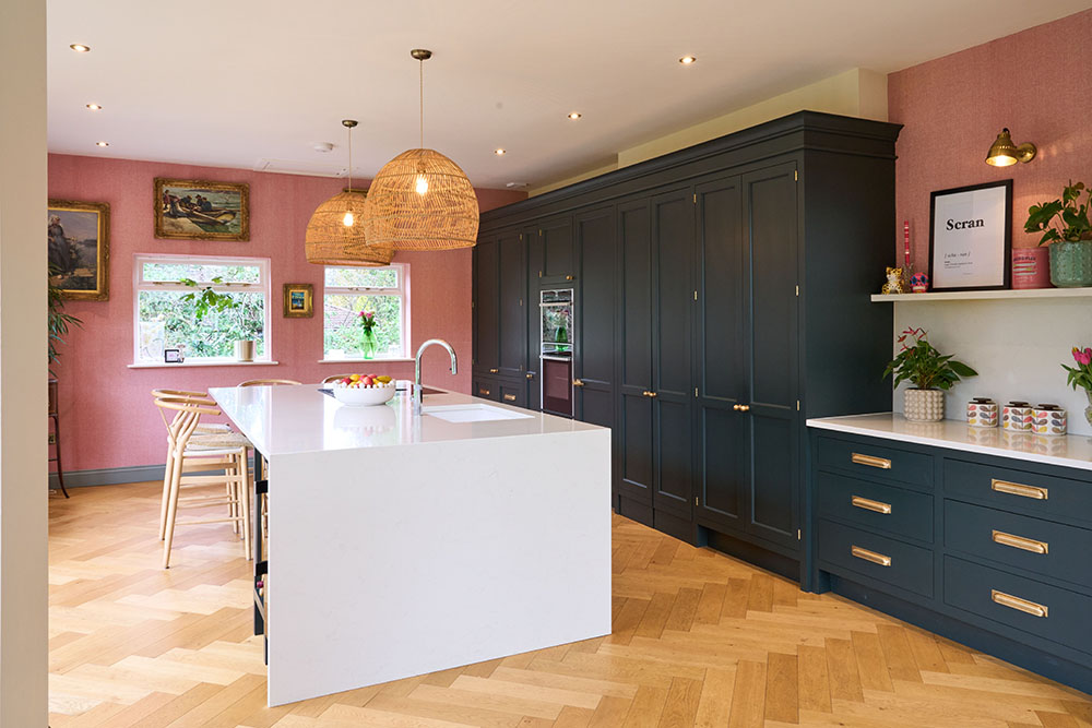Pink and blue kitchen with island coutner