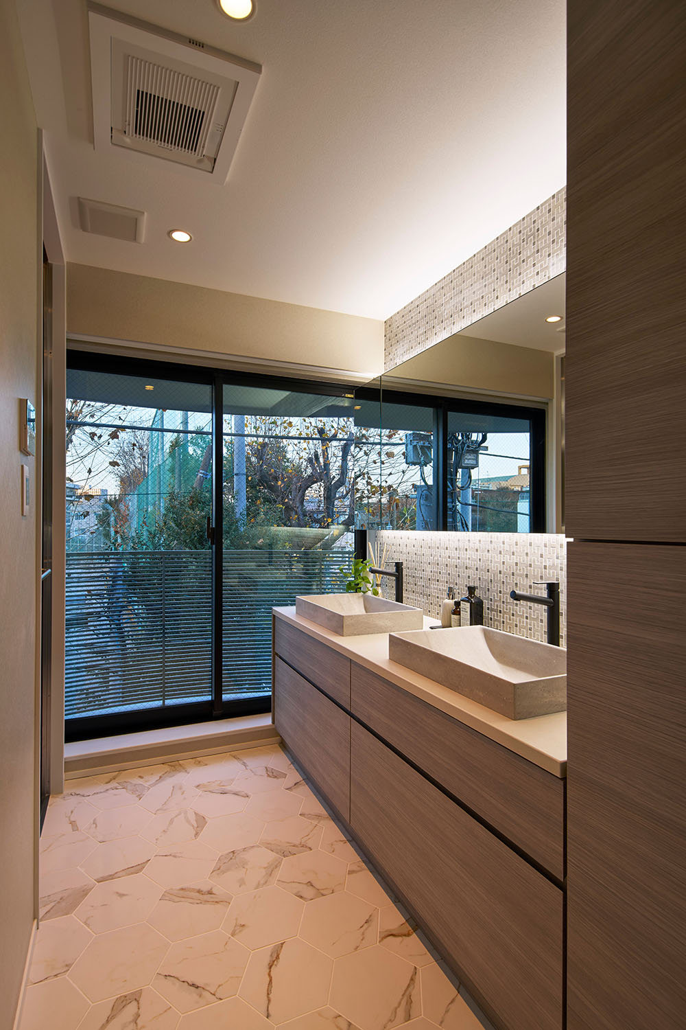 Sinks and floor to ceiling windows