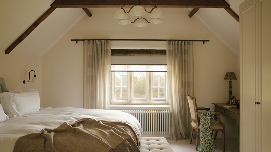 Heritage bedroom with VENESTRE sheer curtains and roller blind, creating a layered window treatment that balances softness, privacy, and natural light.