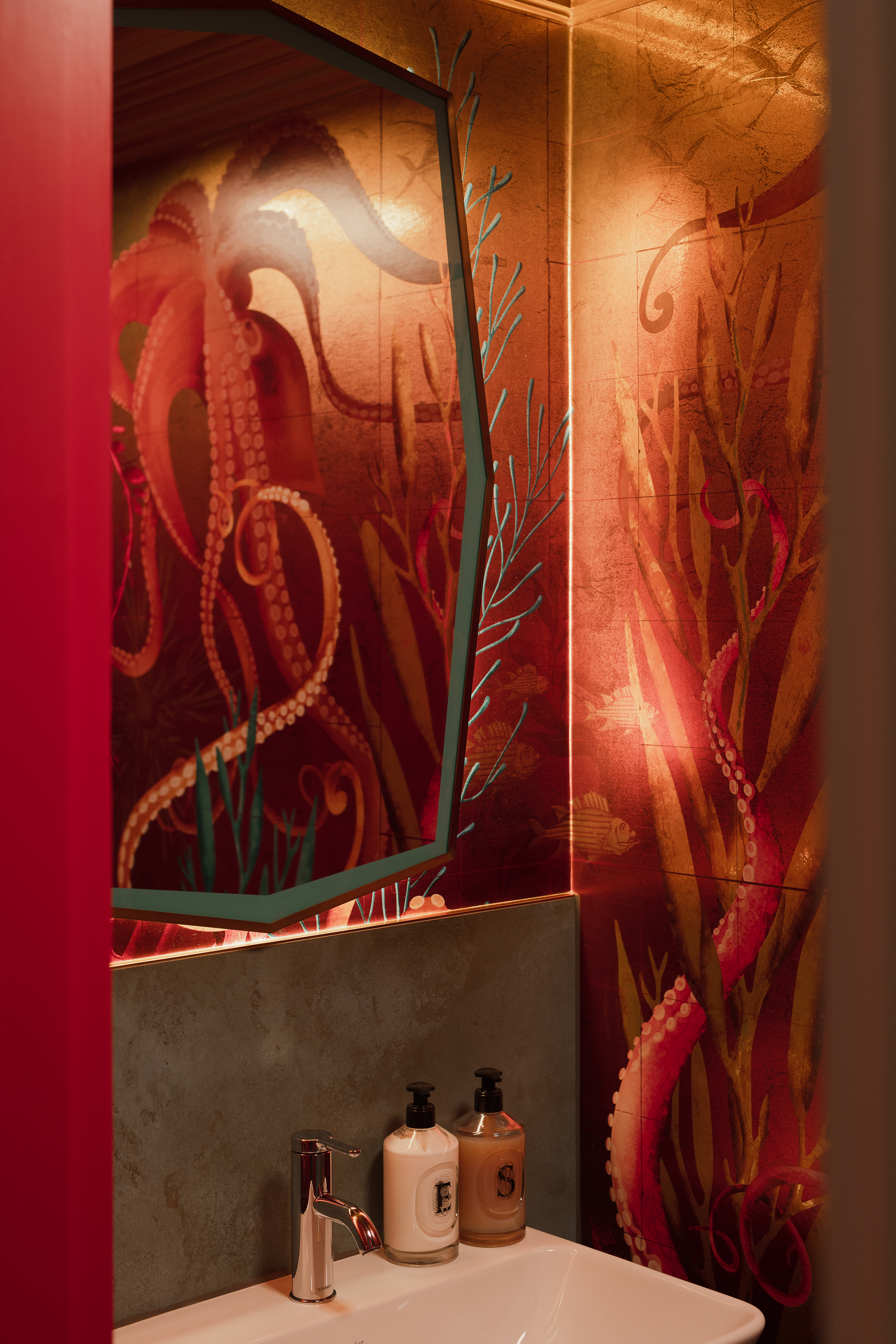 Bright coloured octopus wallpaper design in a small cloakroom
