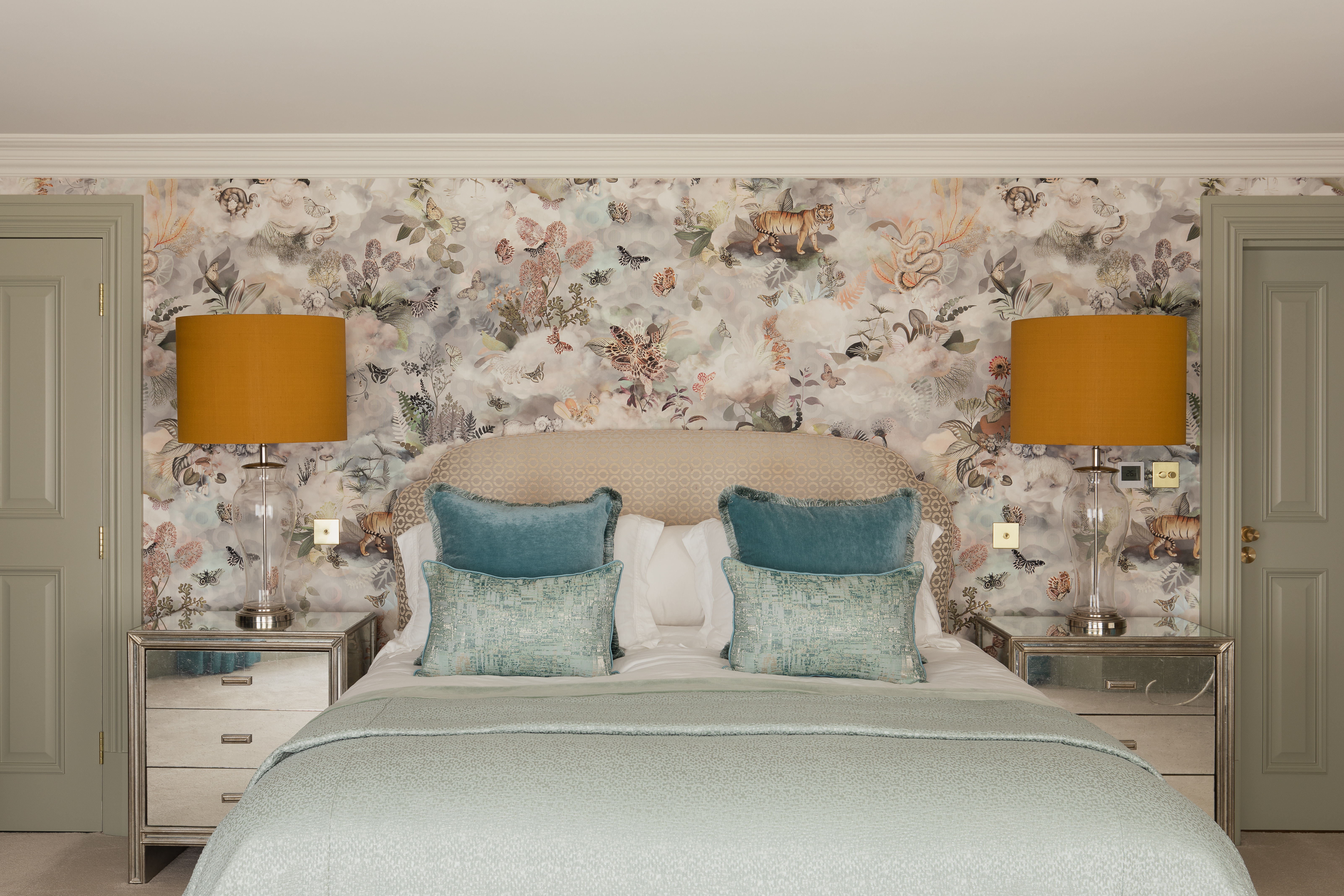 Guest bedroom with pale restful green colour palette and another Moooi wallpaper