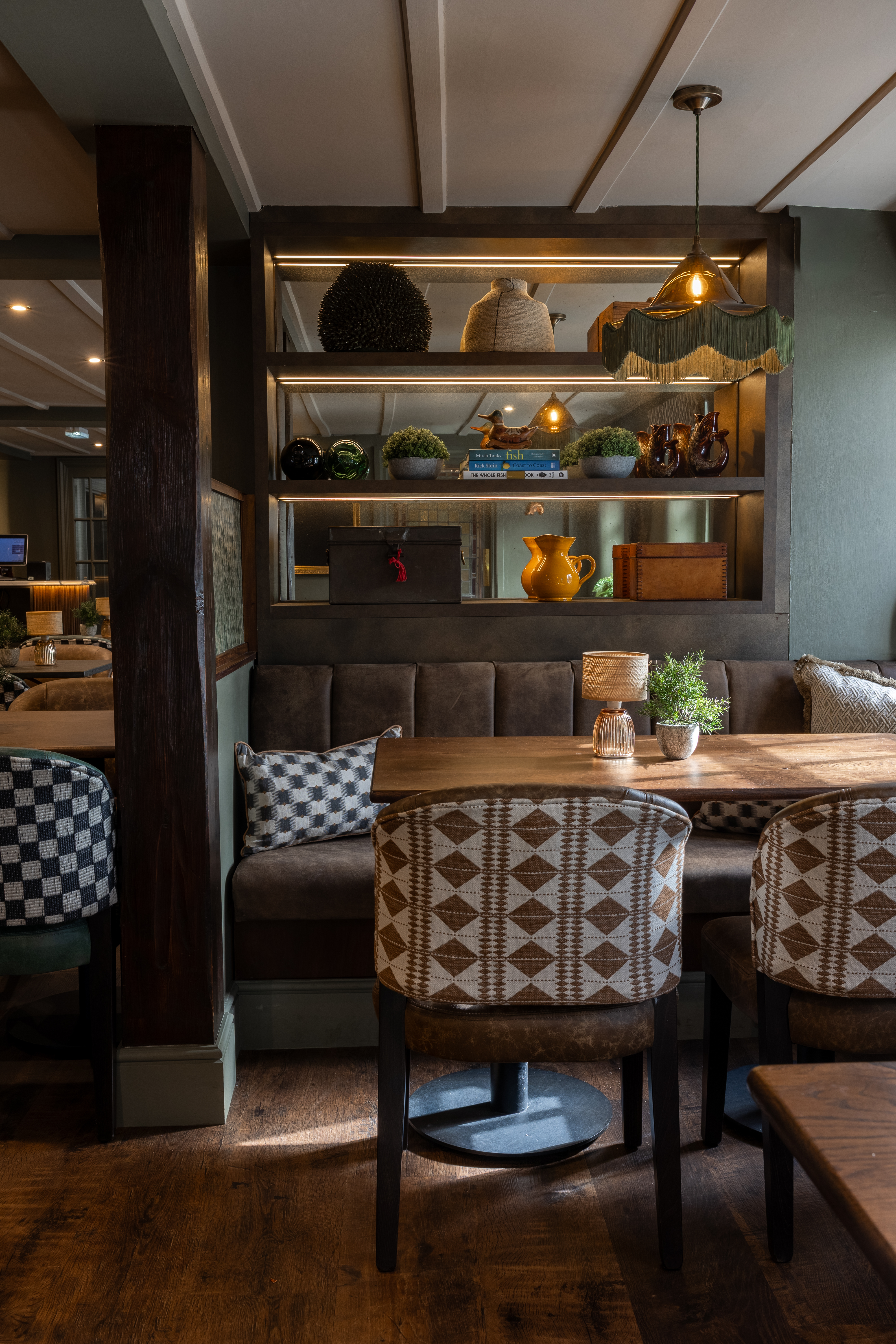 Cosy dining nook with styled shelves