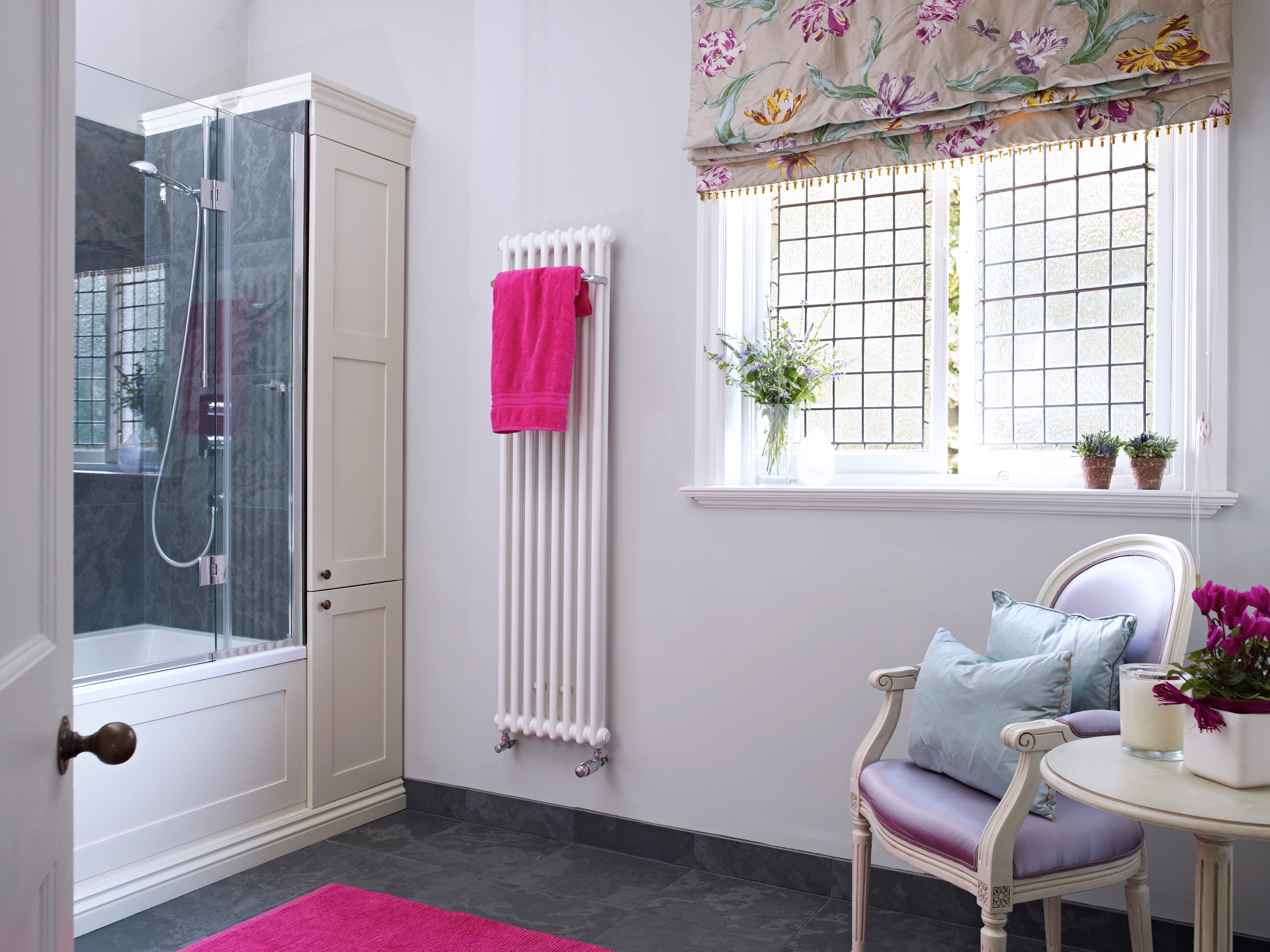 An unused, cramped & ugly bathroom becomes a grown up, warm and relaxing space with storage.  We repositioned a HW cylinder in a loft above