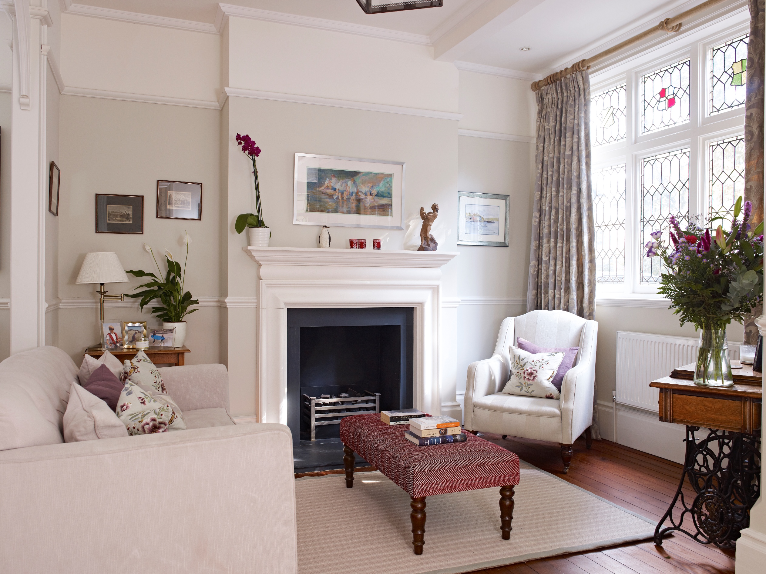We opened up and reinstated the fireplace and polished the newly discovered original boards, creating a traditional seating and reading area