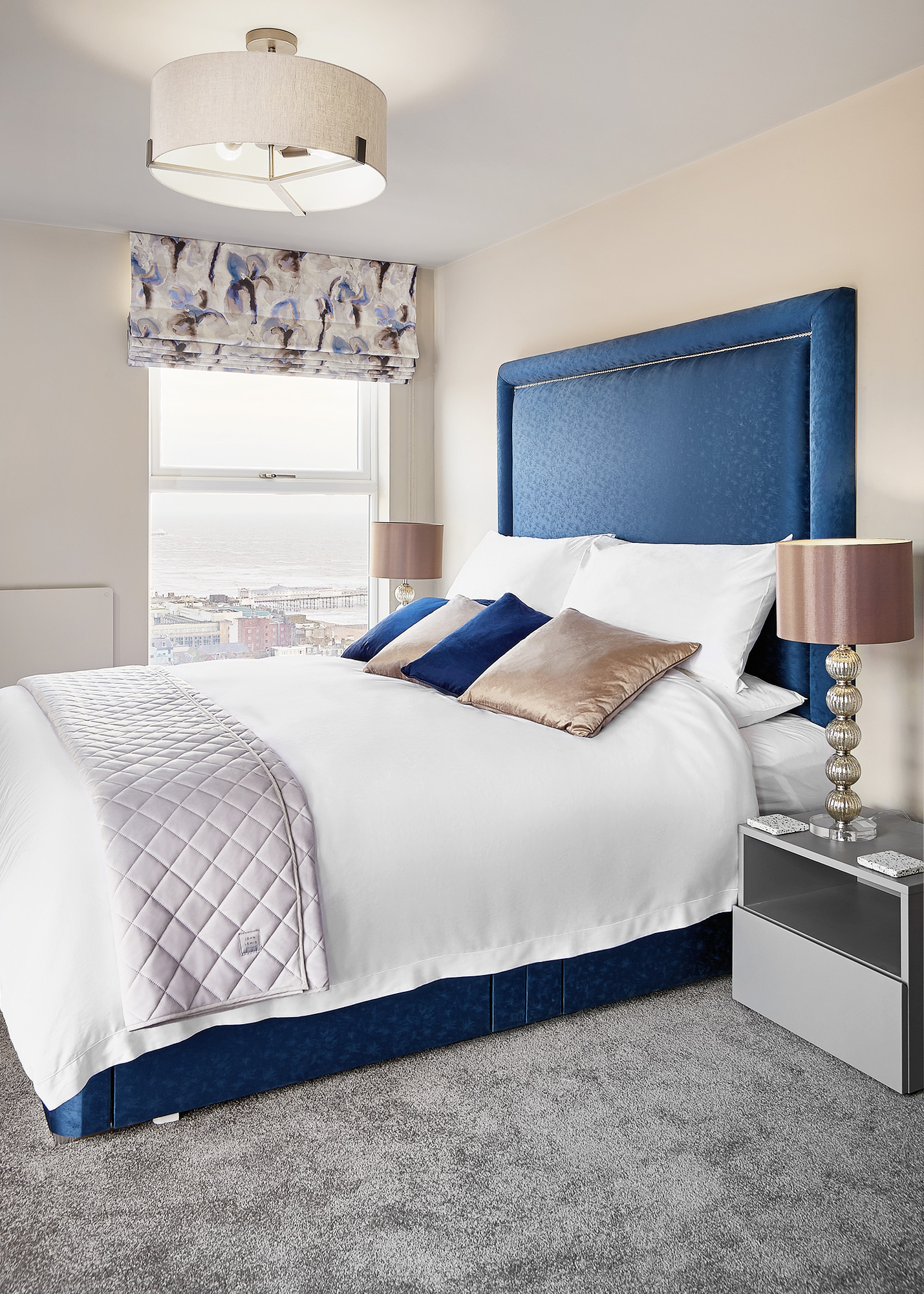 Master bedroom with blue headboard