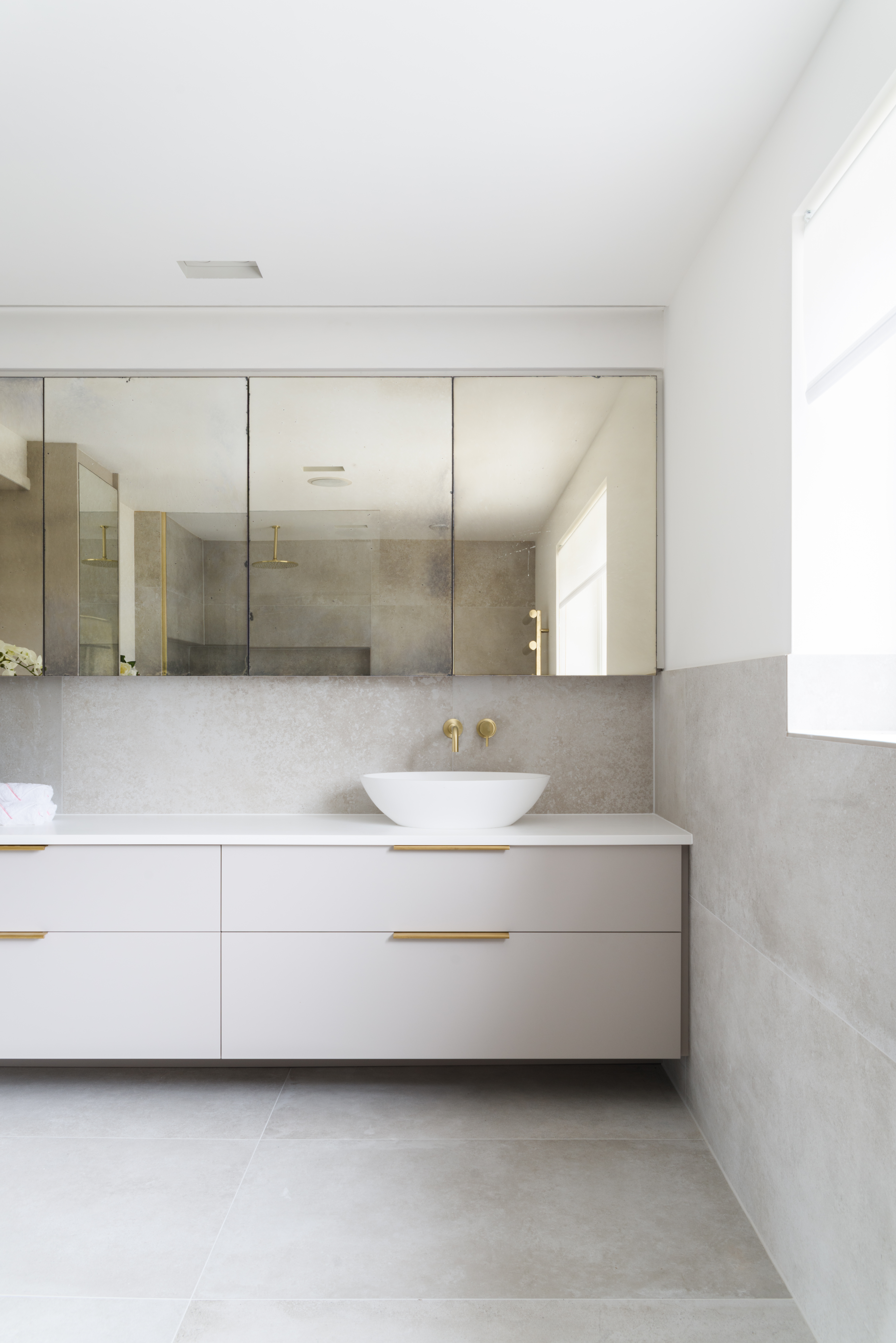 elegant wall hung vanity unit with white bowl and antique mirror storage large porcelain tiles