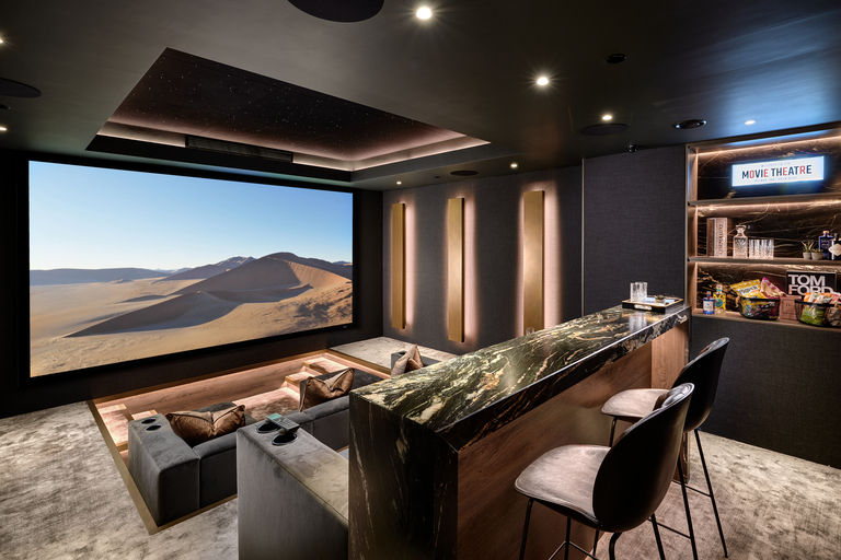 Home cinema with bar and sofa in sunken space