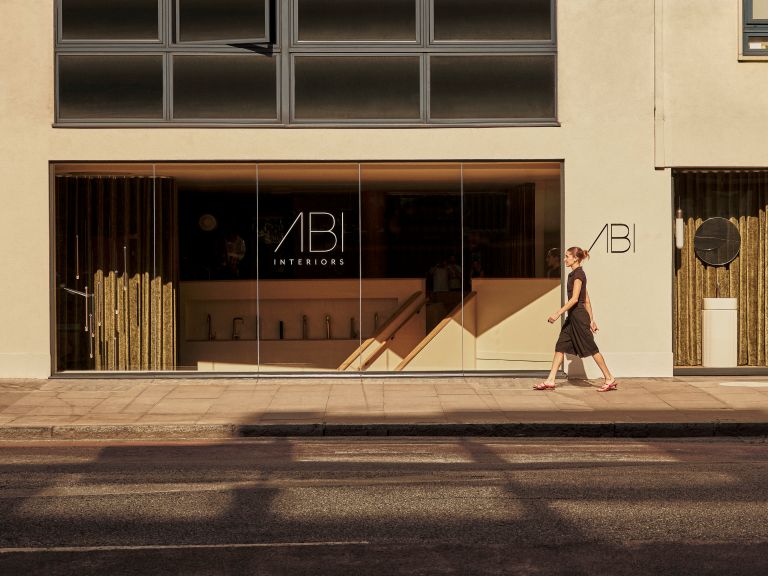 Front outside view of ABI Interiors Clerkenwell showroom with a lady walking past.
