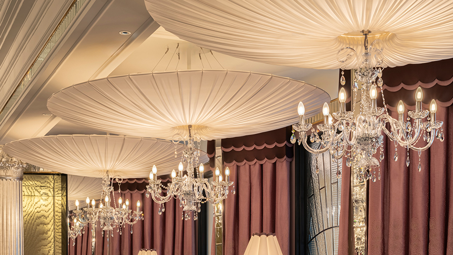 Giant-Canopy-Lampshades-and-trimmed-silk-coolie-table-lampshade-screwed-down-a-banquette-seating
