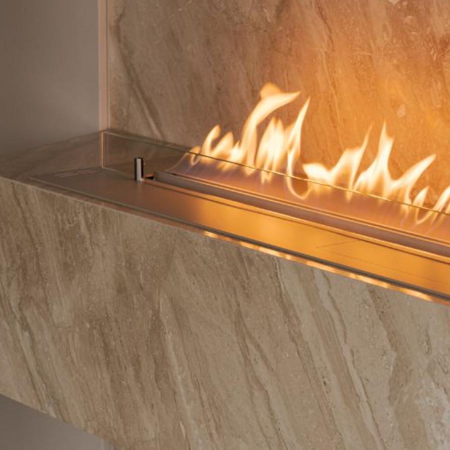 bio-ethanol fire burns in marble casing
