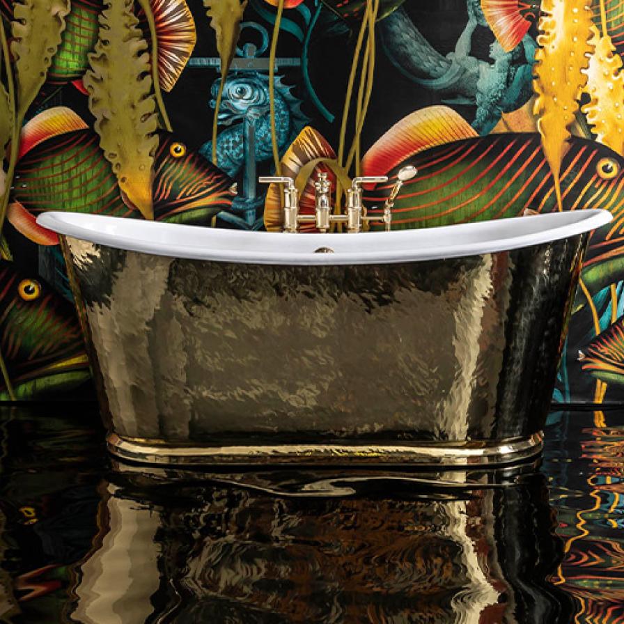 Copper bath against tropical wallpaper