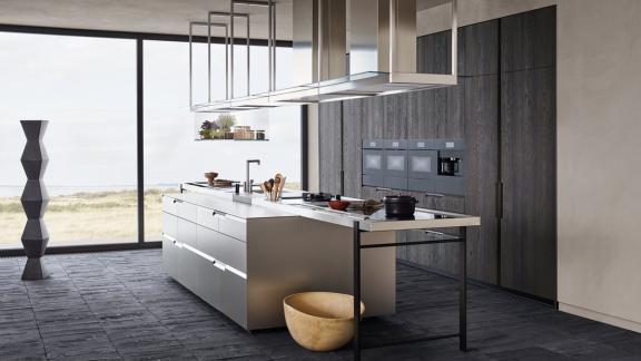 Modern kitchen with floor to ceiling windows on the back wall