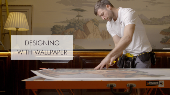 Craftsman cutting wallpaper with CPD name to the left.